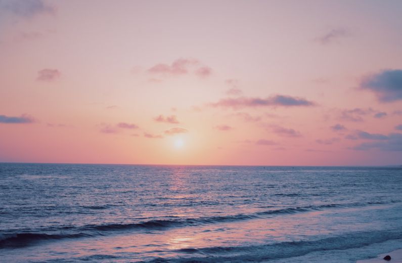 Dreams Creativity - orange sunset sky over the beach