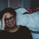 Resilience Emotion - person crying beside bed