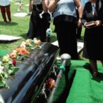 Loss Rebuilding - group of people attending burial