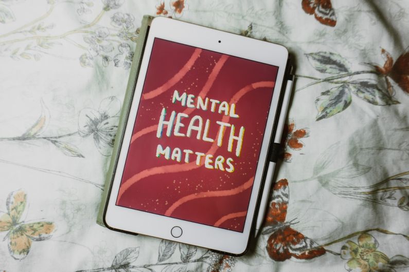 Mental Toughness - a tablet with the words mental health matters on it